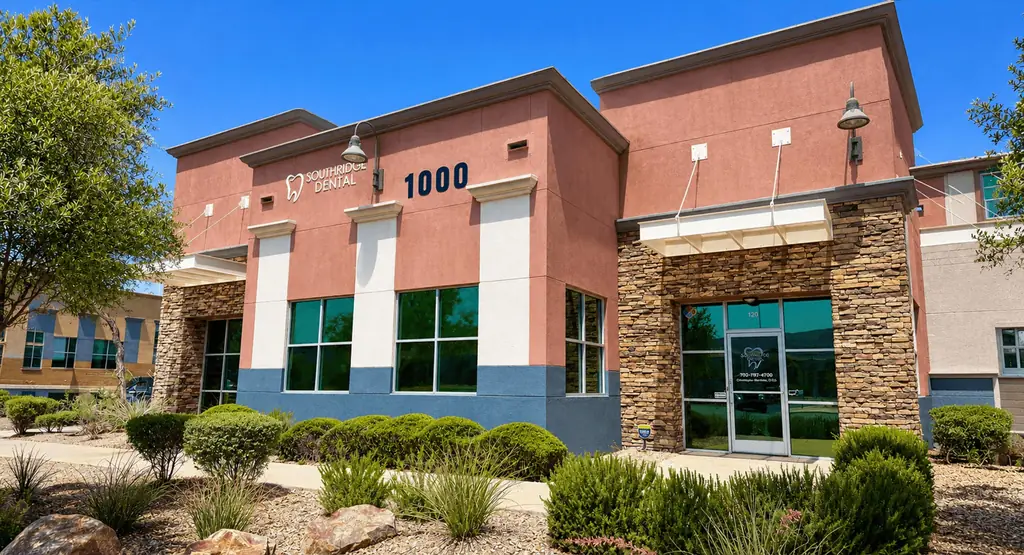 The stone entrance to Suite 120 at 1000 Wigwam Parkway, with the practice phone number on the glass door